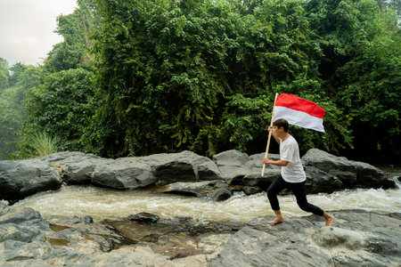 asian male with indonesian flag celebrating independence day