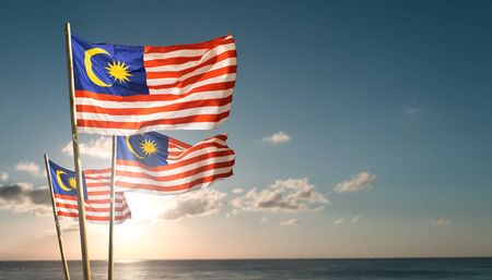 malaysia flags under blue sky independence day conceptの写真素材