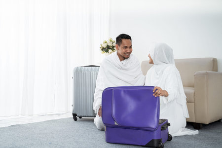 muslim family preparing luggage before hajjの写真素材
