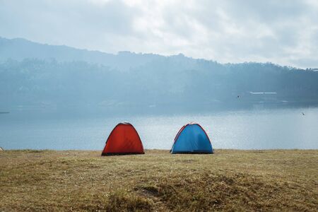 Two tents in the side lakeの写真素材