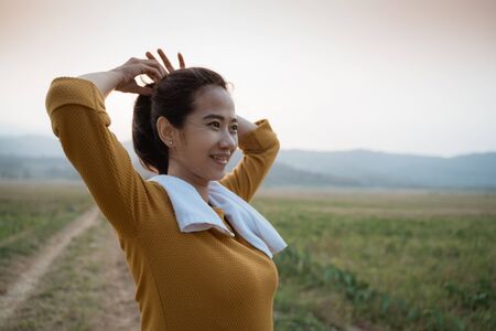 active beautiful young woman tied her hairの写真素材