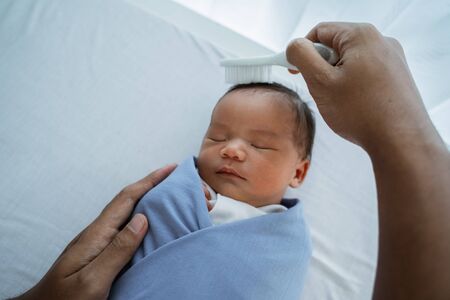 Asian baby girl cleaned earsの写真素材