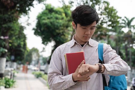 portrait of male student in a hurryの写真素材
