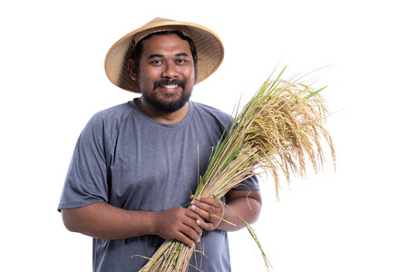 happy farmer after harvesting his rice in the field smiling