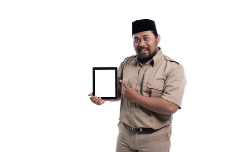 asian worker with brown uniform presenting to blank screen tablet