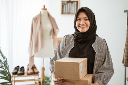 dropshipping business owner preparing product for customerの写真素材