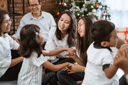 family and friend during christmas gatheringの写真素材