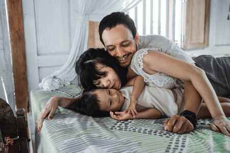 Asian happy family and child daughter laughing togetherの写真素材