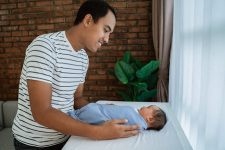 father holding daughter when sleeping