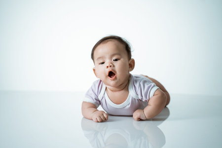 baby is on his stomach developmentの写真素材