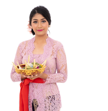 Balinese women bring to offerings for the prayer