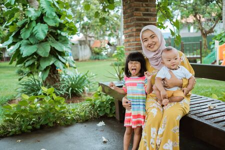muslim asian mother and her childの写真素材