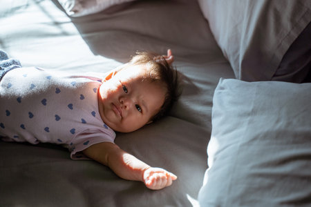 Cute little baby lying on the bed