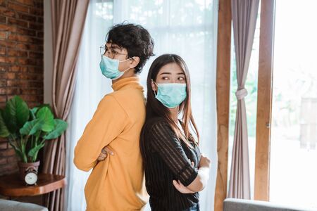 Man and woman with face masksの写真素材