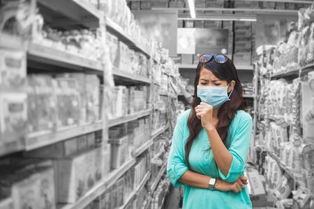 Worried woman in a storeの写真素材