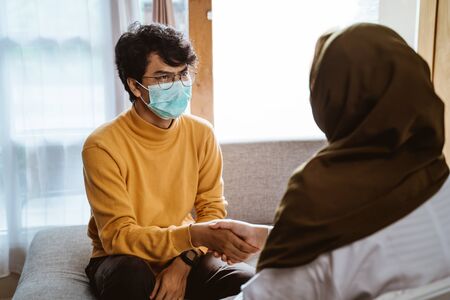 People wearing face masks during epidemicの写真素材