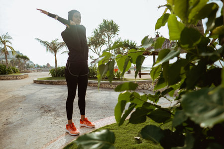 Attractive sport muslim woman with hijab exercise outdoor