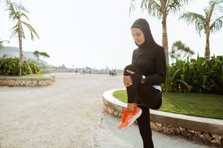 Muslim female workout before fitness training session outdoor.の写真素材