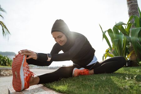 woman with muslim sport wear stretchingの写真素材