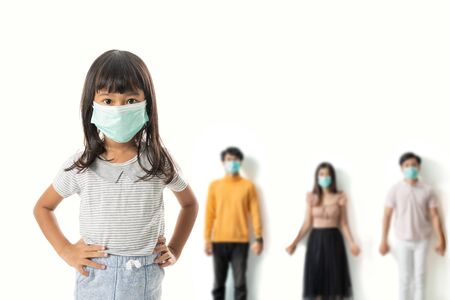 kid with face masks standingの写真素材