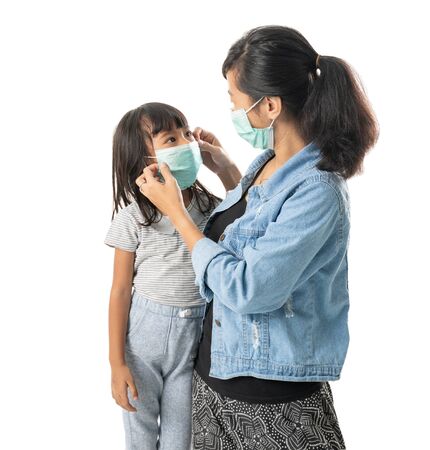 mother and daughter wearing face masksの写真素材