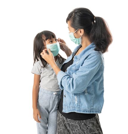 mother and daughter wearing face masks