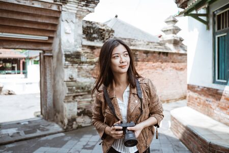 Woman travel taking pictureの写真素材