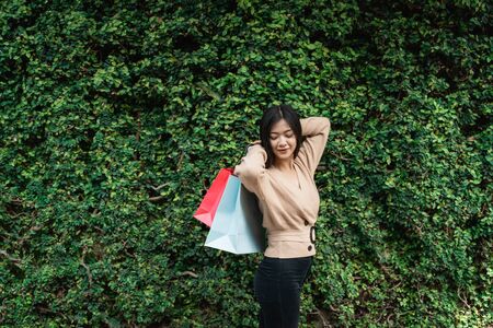 Woman with paper bags enjoy shoppingの写真素材