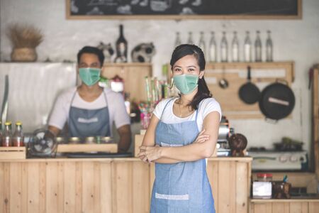 waitress at the shop wear face masksの写真素材
