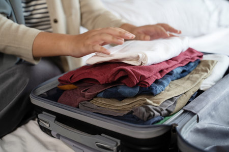 muslim veiled woman packing some clothes