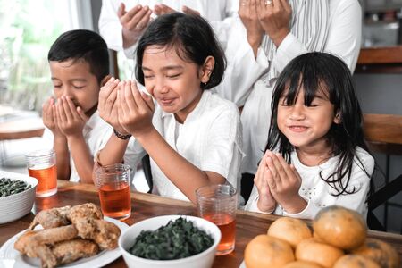 children pray muslim open armの写真素材