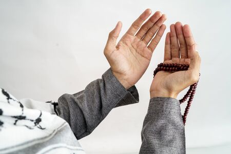 hand open arm while pray in islamic cultureの写真素材