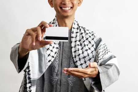 male muslim with credit cardの写真素材