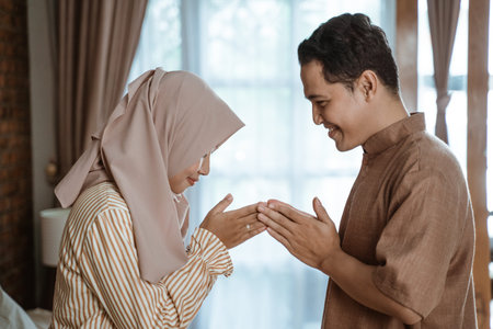 muslim man and woman asking for forgivenessの写真素材