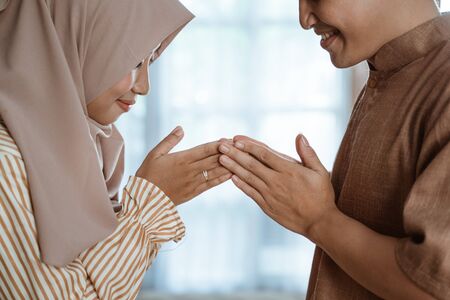 muslim man and woman asking for forgivenessの写真素材