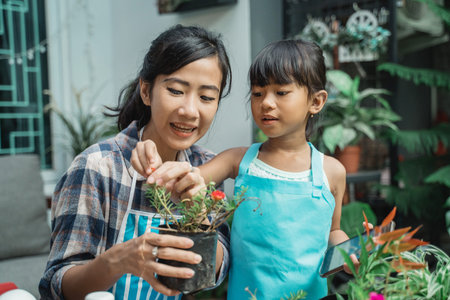 mother and her daughter gardening together