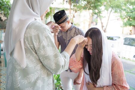 shake hand kiss apologizing each otherの写真素材