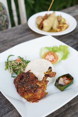ayam balado. chicken served with riceの写真素材
