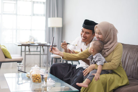muslim family taking selfie togetherの写真素材