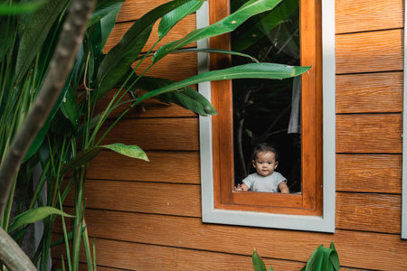 cute asian baby peeking