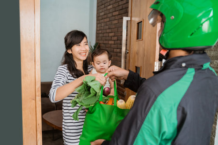 woman and baby shopping grocery online