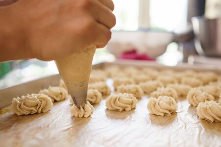 semprit cake. asian bite sized dessert. piping some dough kue sepiritの写真素材