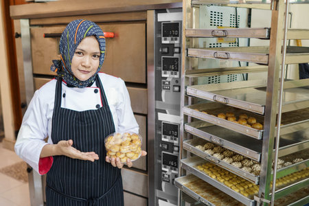 woman muslim food entrepreneur with her product