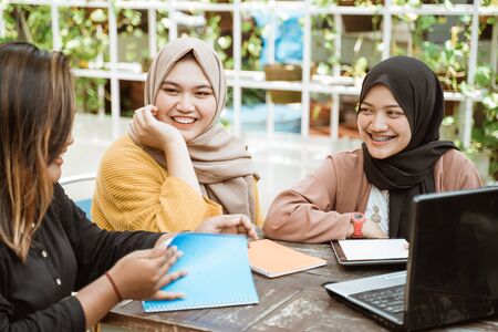 Asian group of students learning using laptopの写真素材