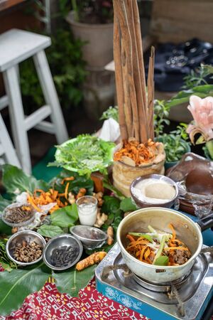 turmeric, lemongrass and secang wood shavings on a green leaf tray the raw material of jamu empon-emponの写真素材