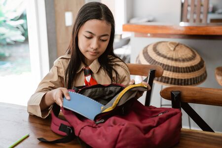 asian girl scout student preparing before going to schoolの写真素材