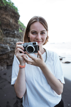 Female photographer taking photo with her camera