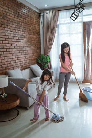 Having fun of two sisters when doing household