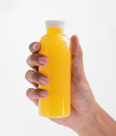 hand holding beverage product on plastic bottle mockup