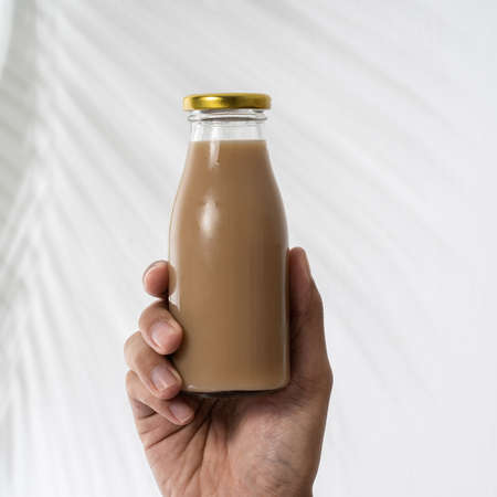 coffee on a glass bottle product mockupの写真素材